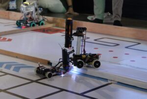 The MRC Sparta robot from MAN Lumajang when completing the mission of putting the ball from the pick-up robot to the receiver robot in the Smart Robot Project category.