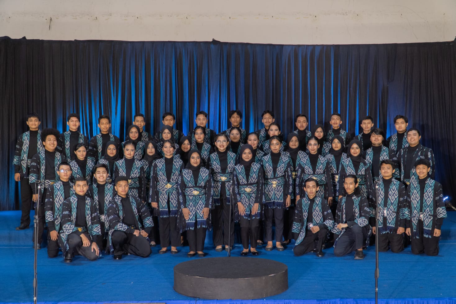 The ITS PSM team when performing for the 10th International Brawijaya Choir Festival 2022 in costumes with traditional West Kalimantan nuances