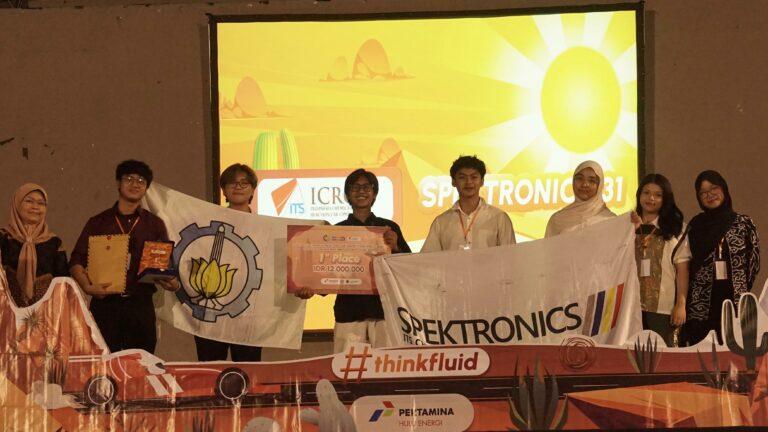 Spektronics ITS team receiving the ICRCC 2026 championship award on stage, celebrating clean-energy innovation.