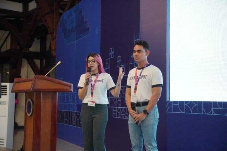 Danya Deluca left and Muhammad Azriel Rizqifadhiilah from Institut Teknologi Sepuluh Nopember ITS presenting Kakarobot screenless robotics teaching kit for 3T regions at Hult Prize Indonesia competition at Bandung Institute of Technology ITB