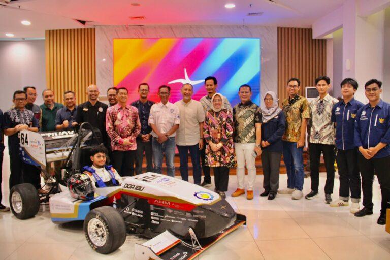 ITS executives, faculty advisors, and members of the ITS Sapuangin Team pose for a group photo during the launch of the team's latest Formula Student race car, Sapuangin Speed 8.