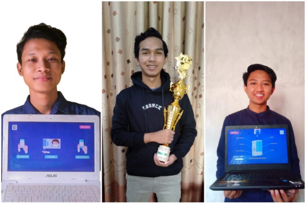 Nanak Cito Tetuko, Egik Ardiatmajaya, dan Mohammad Jailani saat menunjukkan piala dan prototype presensi pintar buatan timnya